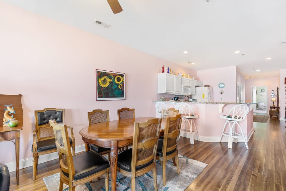 Dining and kitchen area with bar seating