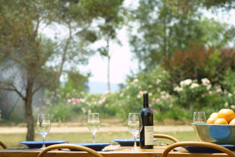 Alfresco dining overlooking gardens and olive groves
