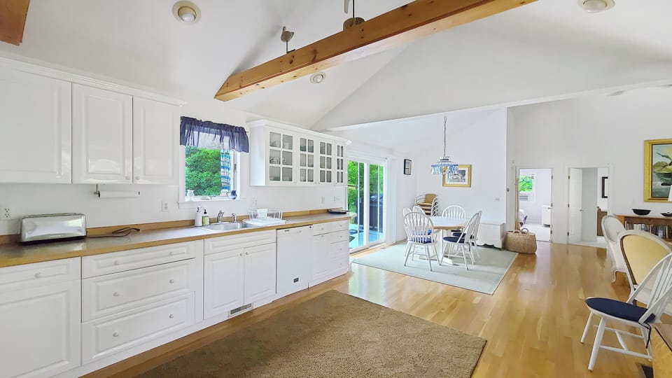 Nicely equipped kitchen with dining area beyond