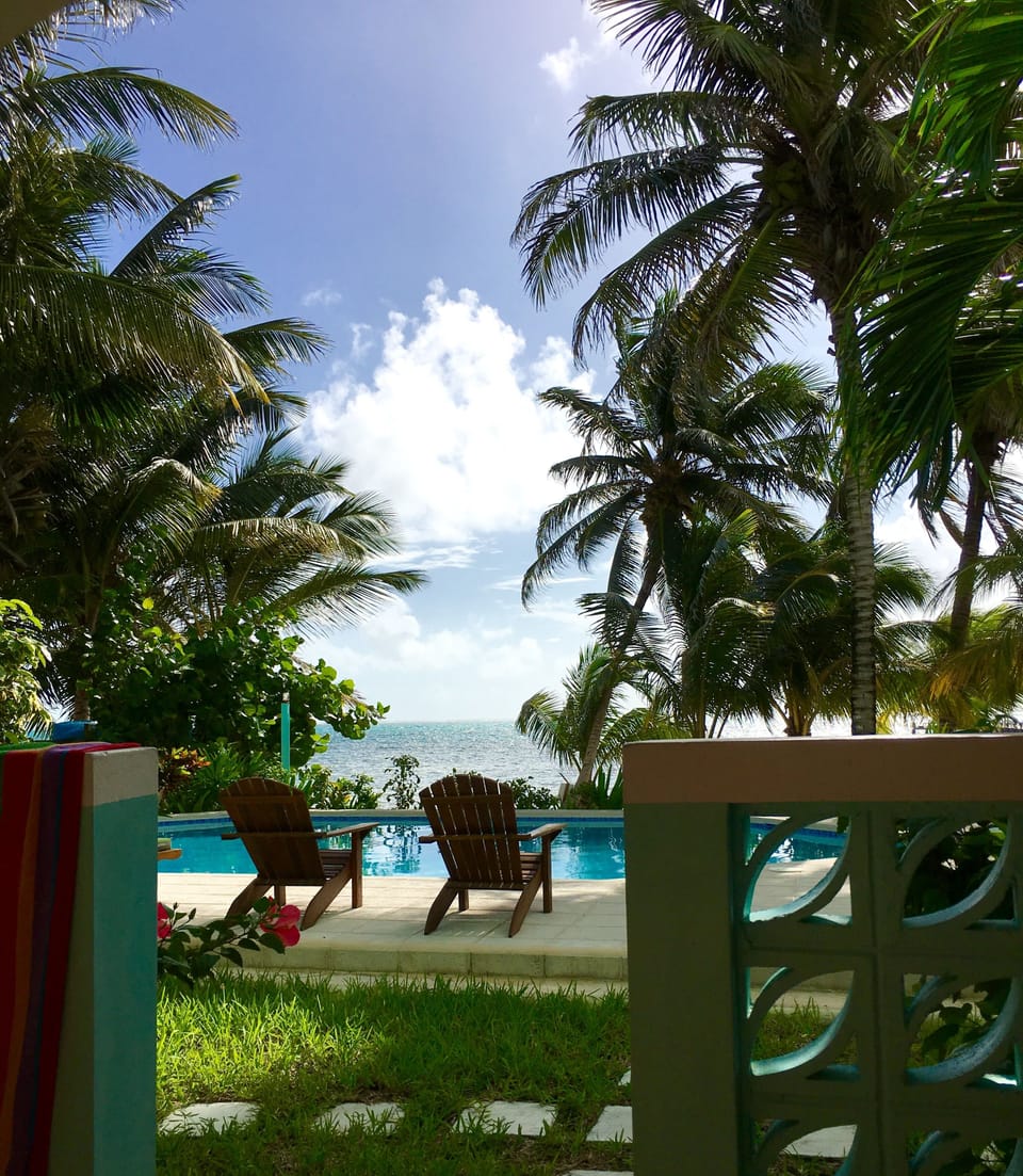View of the pool and the Caribbean Sea from our lanai