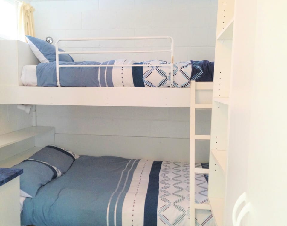 Built in double bed with single bunk above plus plenty of storage.