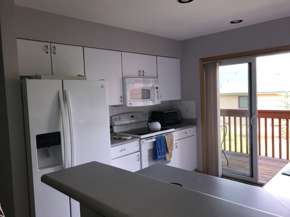 another shot of kitchen with sunny deck