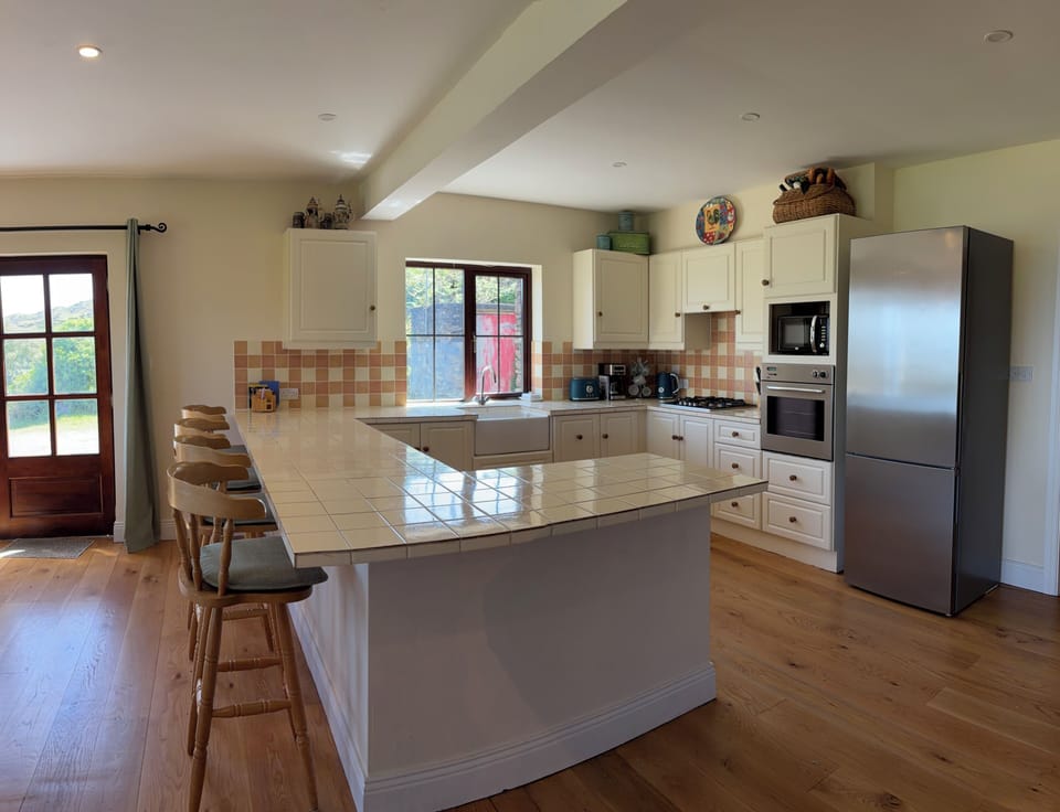 Kitchen with all appliances including dishwasher. Seats 4 at the counter