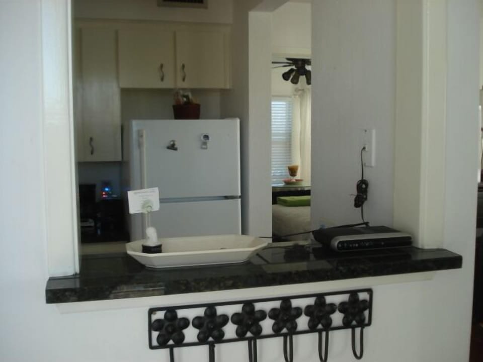 Entrance door opens to this view of kitchen
