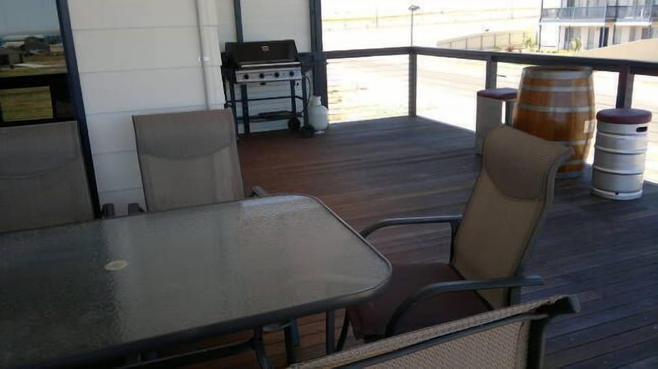 balcony/ deck with clear blinds for wind protection.