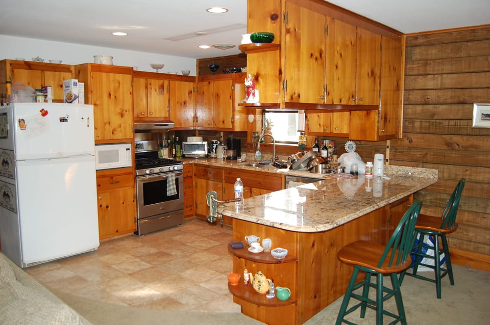 Kitchen--granite counter, gas stove and oven