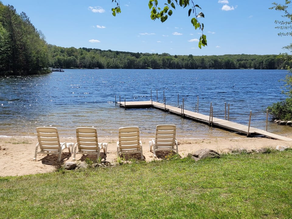 Beautiful sandy beach with dock.