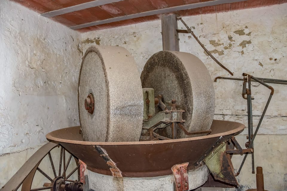 The Old mill stone in the antique olive mill at Castello di Montegiove.