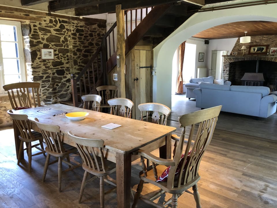 Kitchen table.  Stairs  behind to first floor, sitting room beyond.