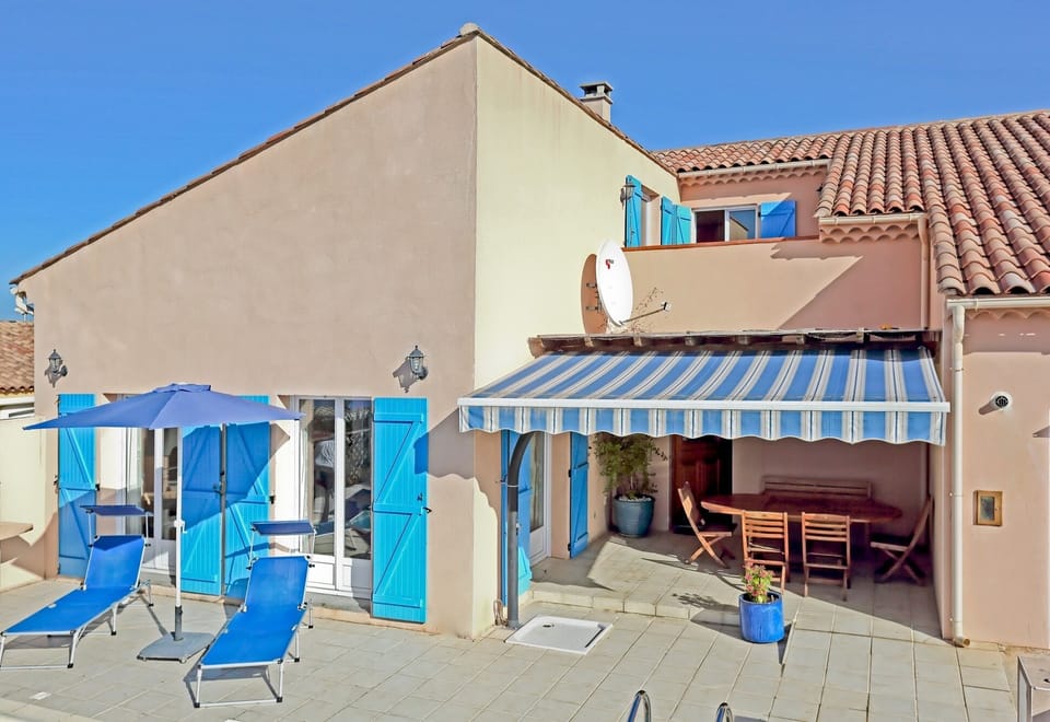 Front of villa with shaded patio.