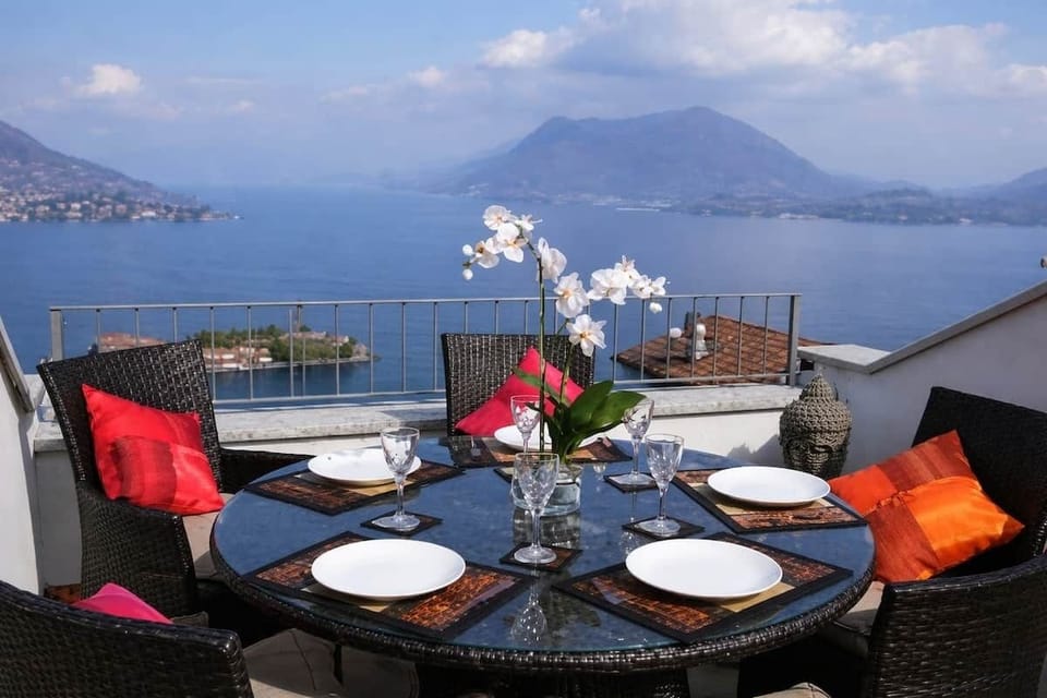 Sip wine above the water as the sun melts into Lago Maggiore. Dine al fresco, breathe in the quiet, and let the Borromean Islands drift by—an unforgettable rooftop moment made for slow evenings and lasting memories.