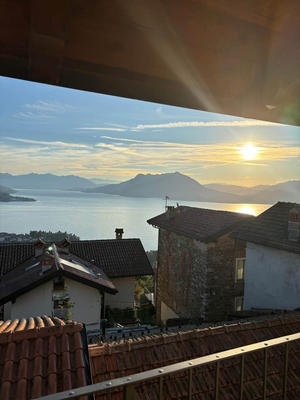 Step through the kitchen doors as sunlight spills across the lake. With the balcony just beyond, everyday moments feel elevated—easy breakfasts, golden hours, and a gentle connection to the view that draws you outside again and again.