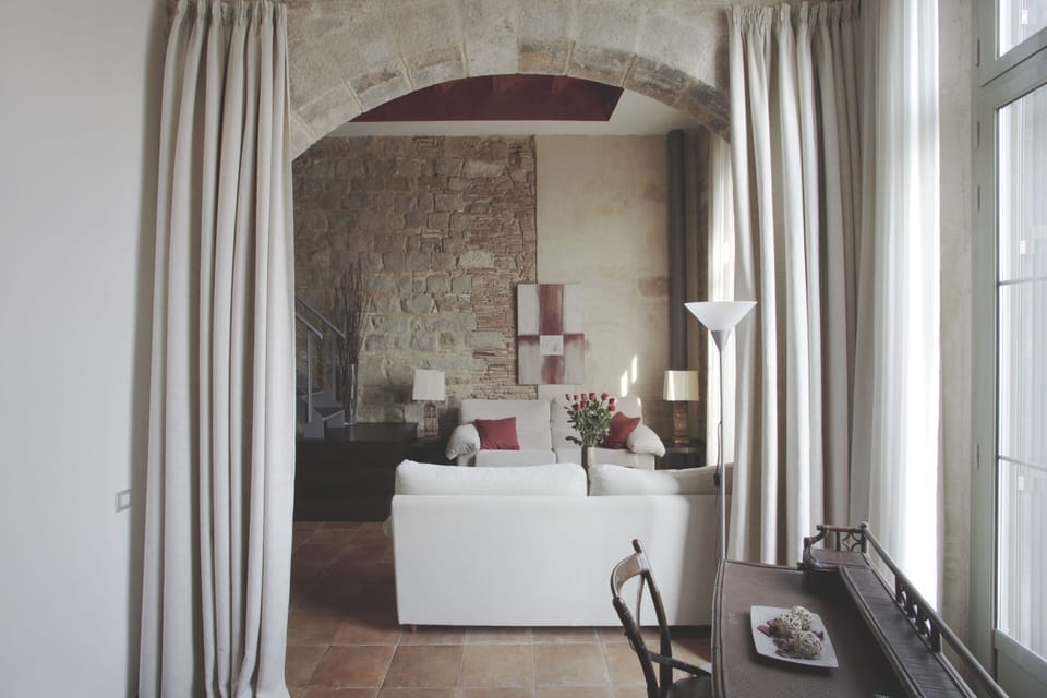 living room and office, conserved XVth century stone arch 