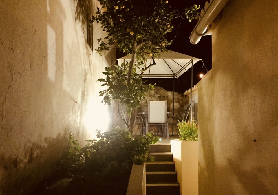 Rear garden dining area at night
