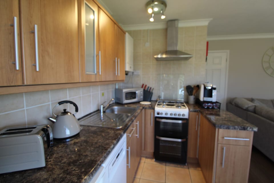  New gas cooker, microwave coffee machine, dishwasher, fridge, toaster & kettle 