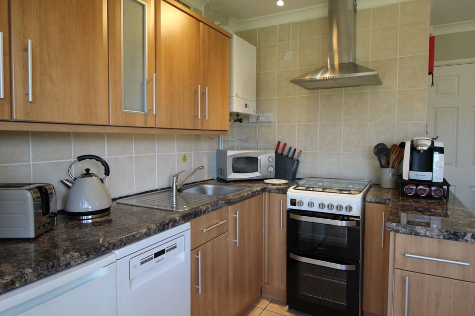 kitchen gas boiler gives instant hot water for kitchen and bathroom.