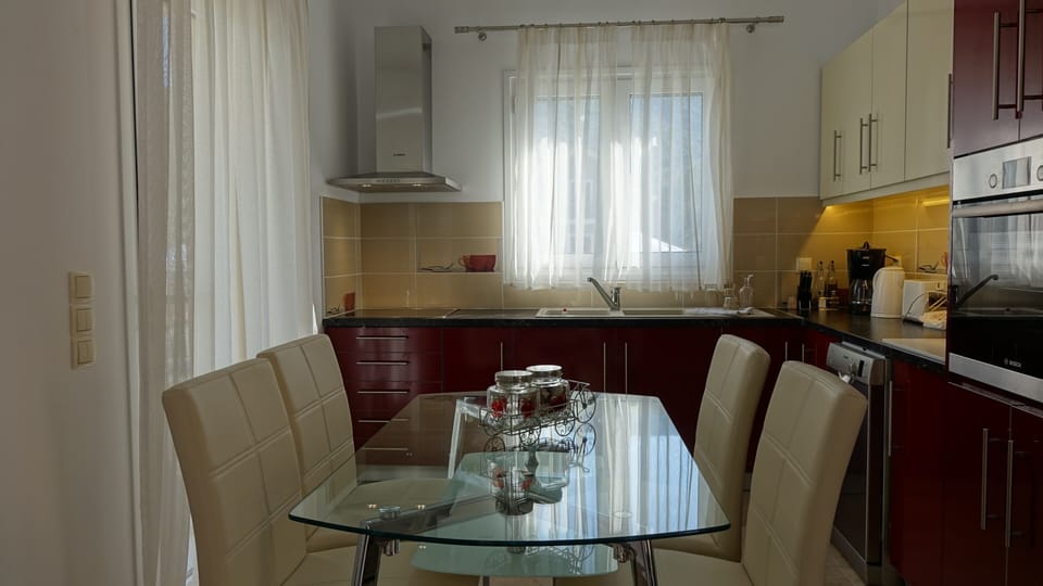 Another view of the well designed kitchen and the dining area