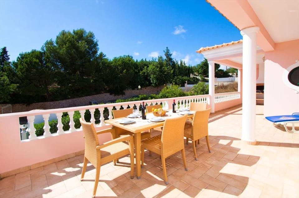 Balcony overlooking the swimming pool, with views to the coast.