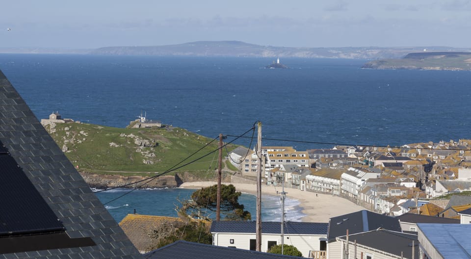 View from house of Porthmeor Beach, Island, and Godrevy Lighthouse, and Bay.