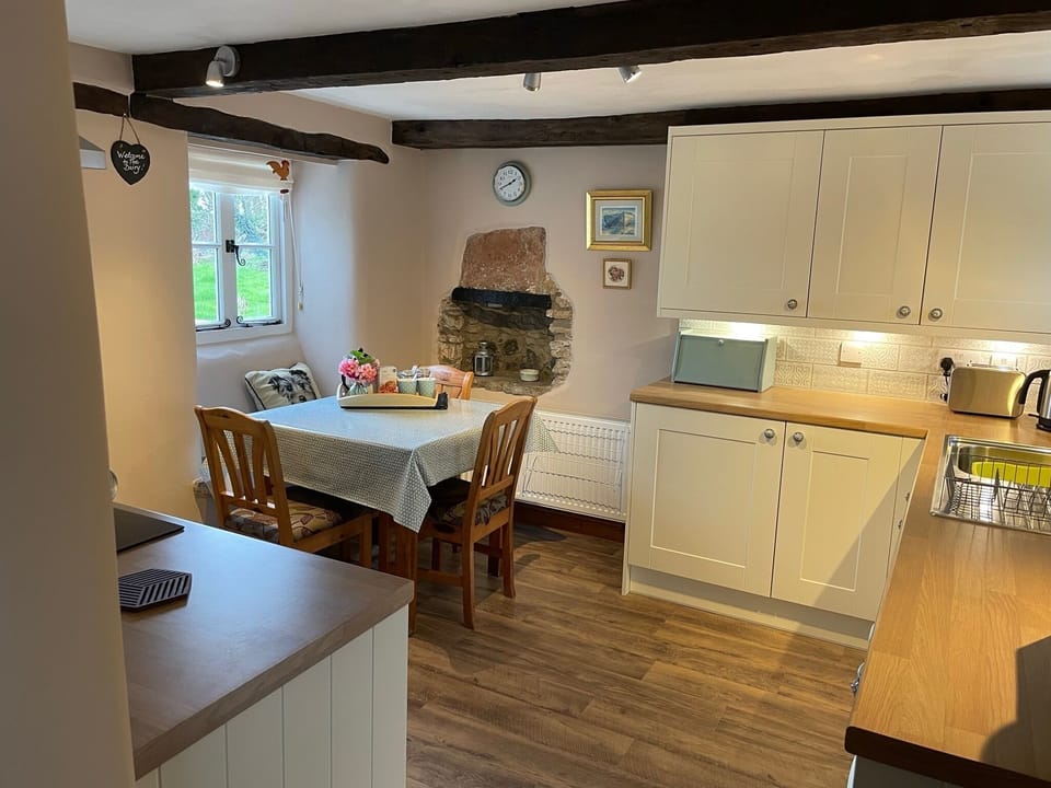 Dining area in kitchen. Table extends can seat up to 6. High chair provided 