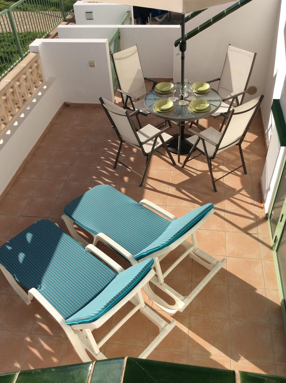 View of the sun drenched sun terrace from the balcony