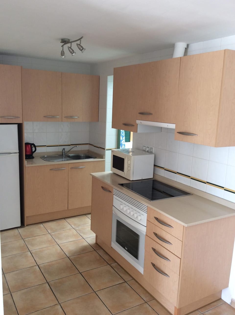 Fully fitted kitchen with door into utility
