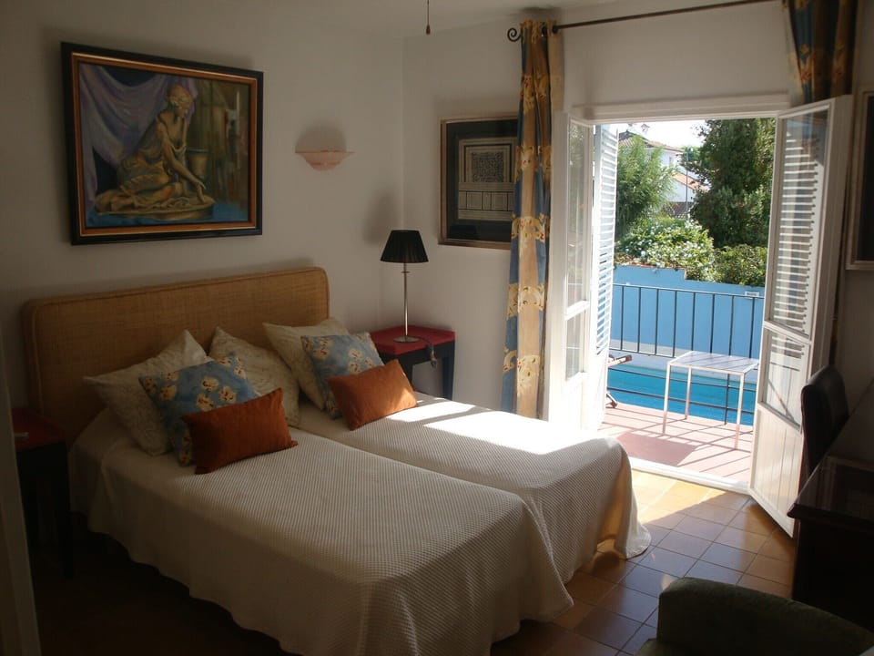 bed room 1, with a balcony to garden