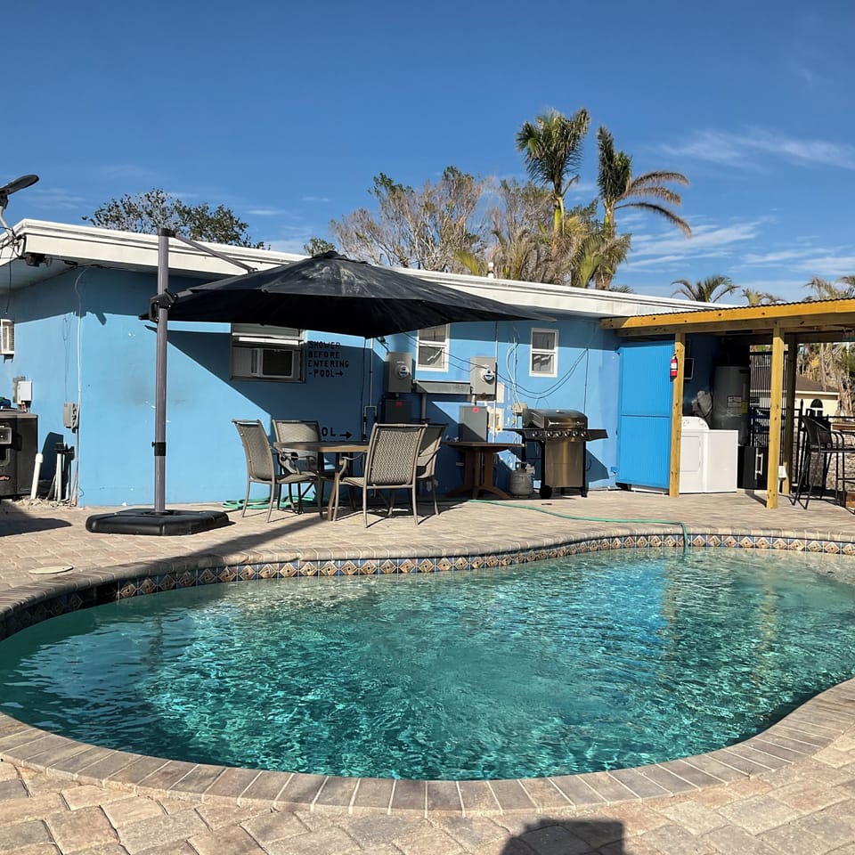 Grill and Table by the Heated Pool