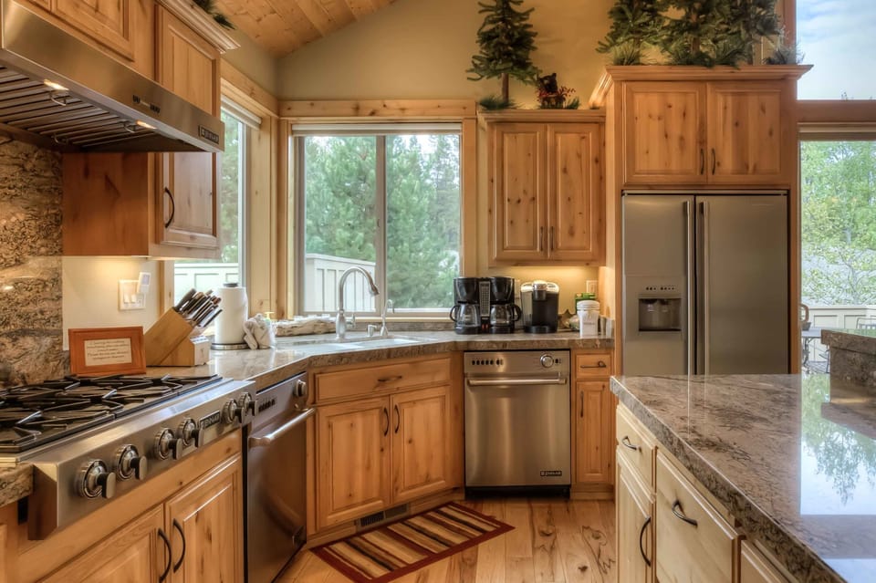 Charming kitchen corner w/ wood counters, stone accents & window light