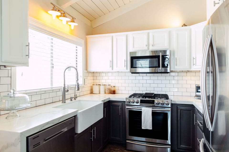 All stainless steel appliances and farm sink and again vaulted ceilings