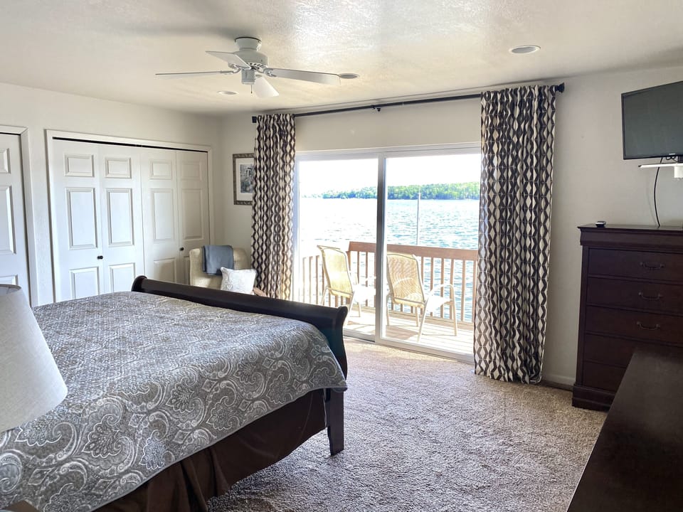 Master bedroom with balcony lake view.