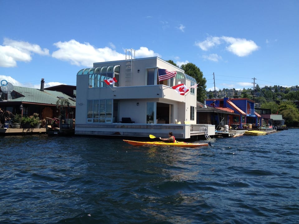 view from Lake Union. hot tub on the deck to the right.  moorage for boat.