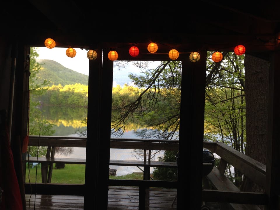 View of water and mountains from screened porch