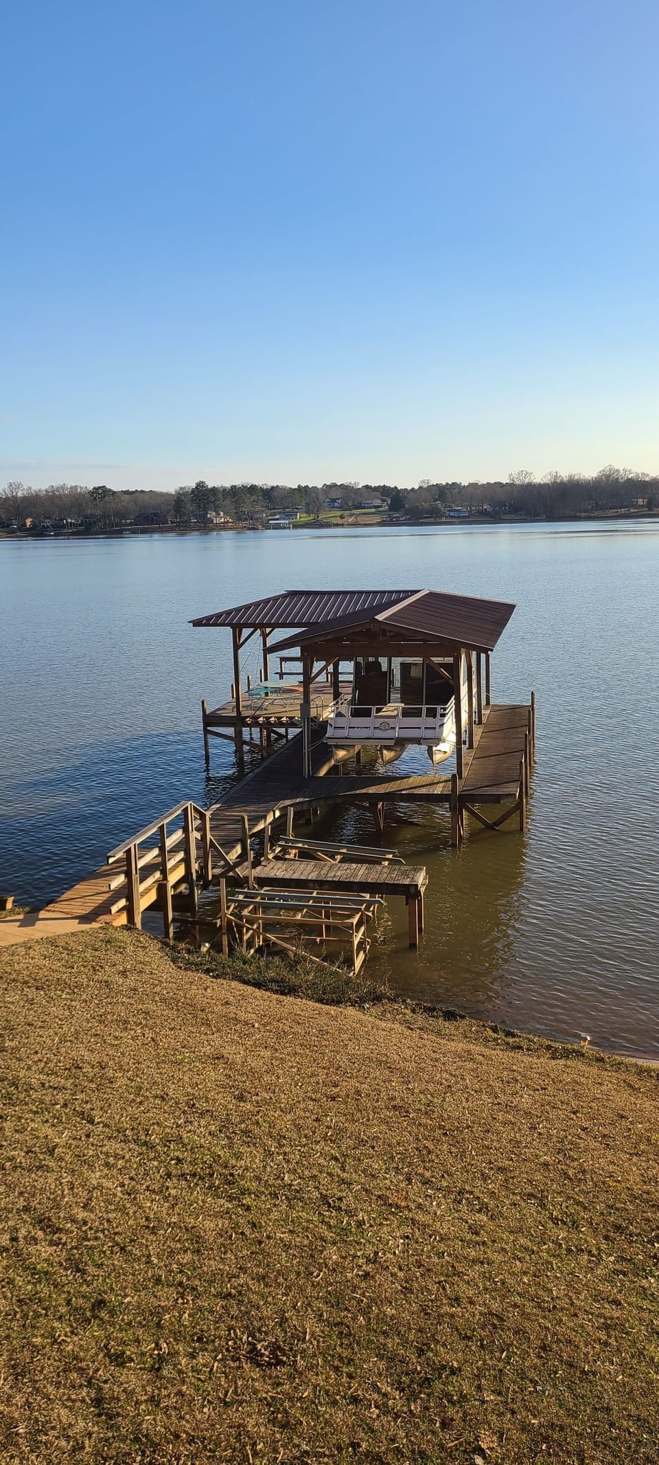 Boat dock with covered area and seating. Boatlift not available. 2 tie up areas
