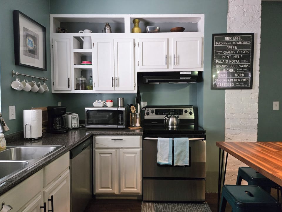 1st FL Kitchen | Supplied with small appliances and cooking staples such as olive oil, salt, and pepper. 