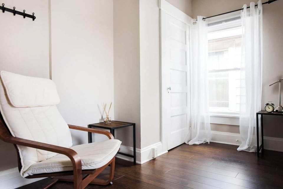 The larger bedroom on the second floor also offers a sitting area.