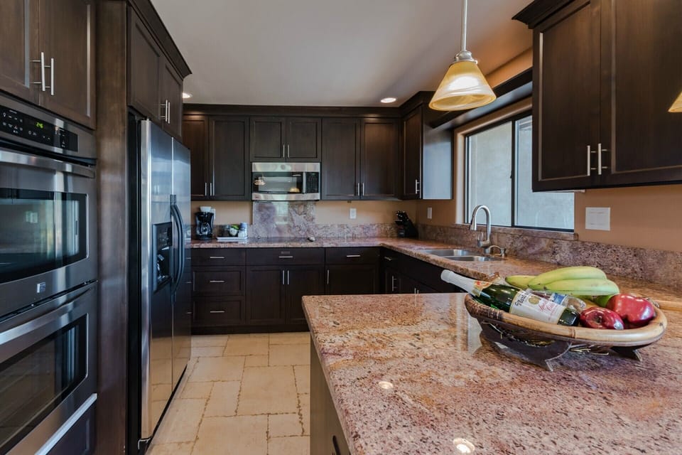 Canyon Breeze Suite #6 fully equipped kitchen with granite and stainless steel.
