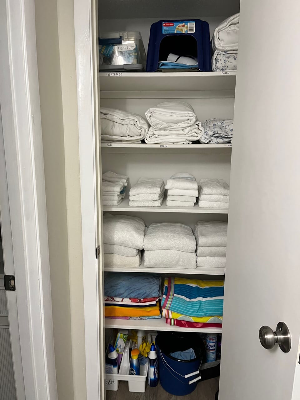 Linen closet with beach towels, bathroom towels and extra sheets