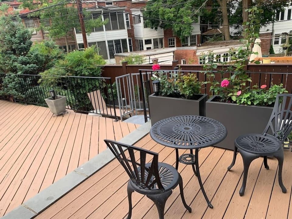 Garden with sun lounges and generous patio seating under the umbrella