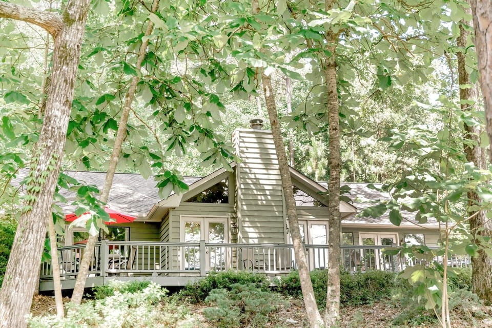 Large trees shade the deck and dock most of the day.