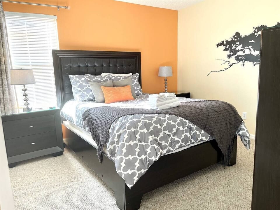 Bedroom #4 with queen size bed, dresser, TV and more.