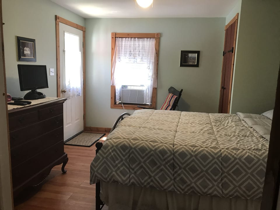 Bedroom 3 with patio access.