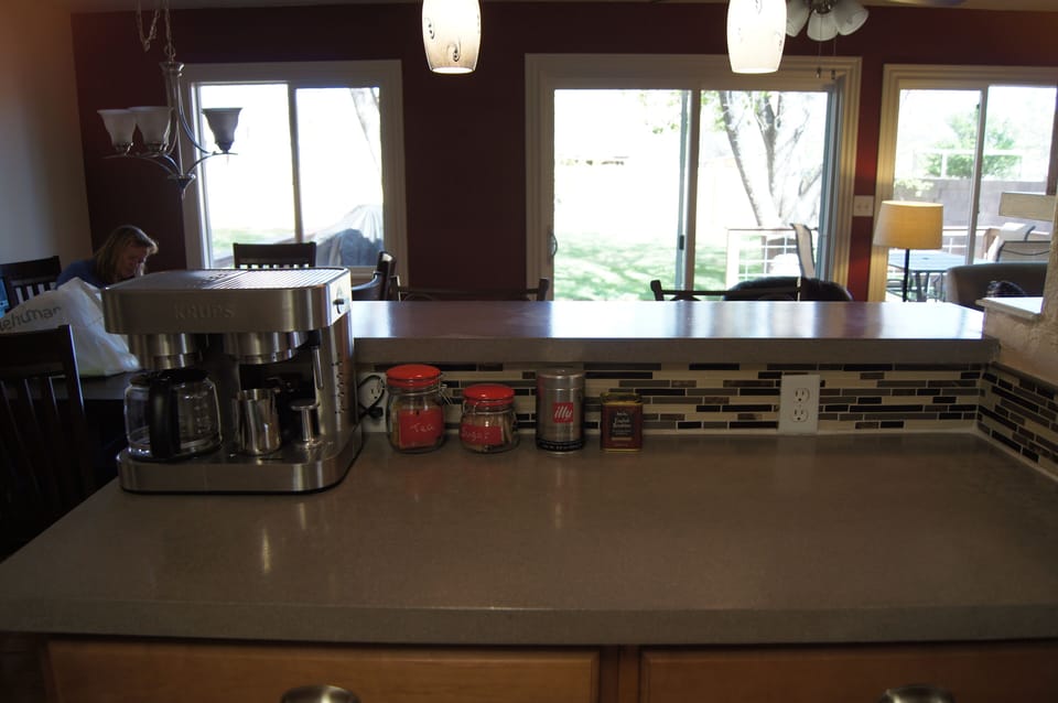 The kitchen is stocked with coffee/espresso and tea, and has views into backyard