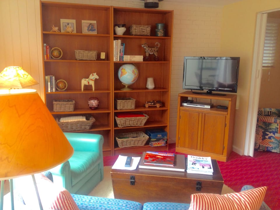 a sitting area with flat screen TV