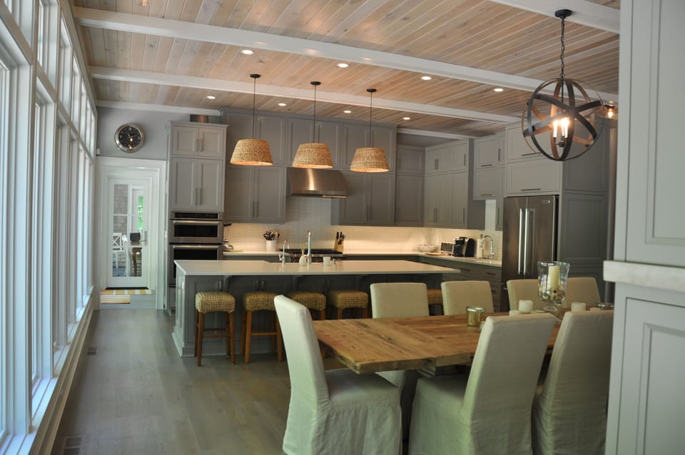 Open kitchen and dining room. Table seats 10, and counter seats 6 