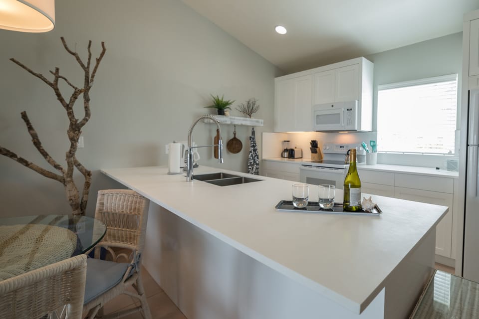 modern kitchen with upgrades and island bar top