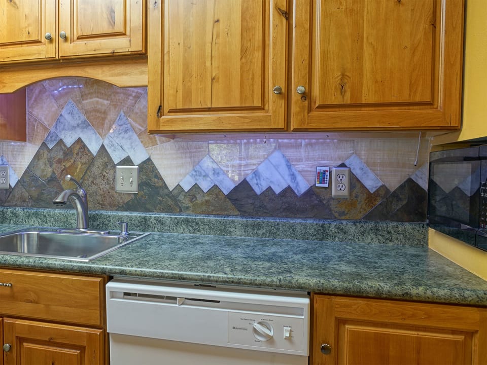 Kitchen area with my awesome custom mountain back splash inspired by dad-n-law!