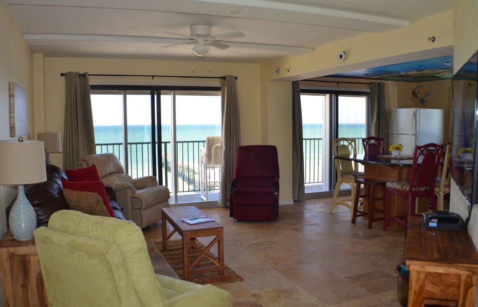 Comfortable large living area/kitchen with 2 oceanfront patio doors