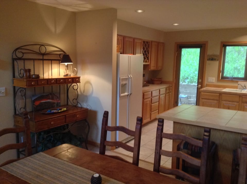 Full size double door refrigerator with buffet service bar.