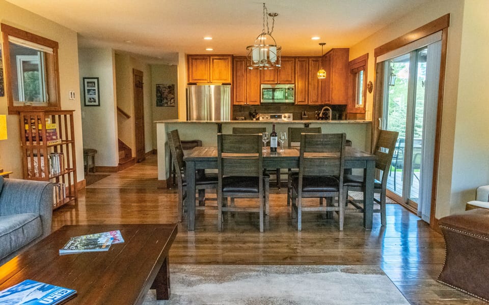 Dining table with seating for 6.  Breakfast bar with 3 barstools.  